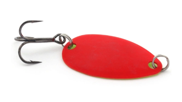 Red micro spoon lure for fishing over a white background